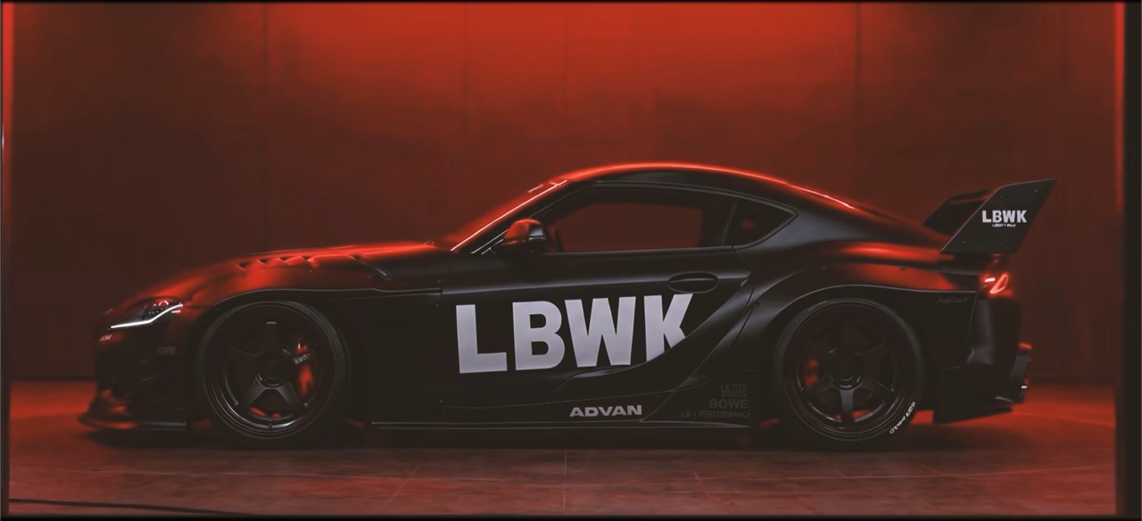 Red-lit side profile of the LBWK model car